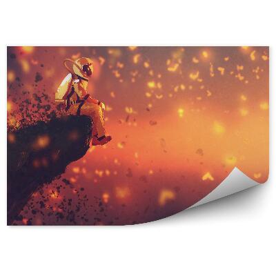 Fototapet perete Astronautul Stă Pe Marginea Unei Stânci De Pietre La Apus