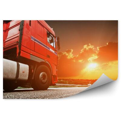 Fototapet vintage Camion roșu în fundal la apus de soare