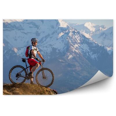 Fototapet Bărbat ciclist mountain bike iarbă de zăpadă