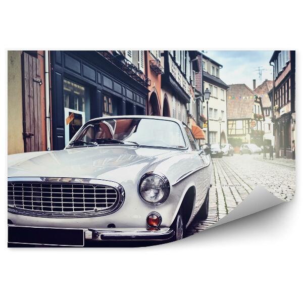 Decor fototapet Clădirile orașului blochează mașina retro strada albă