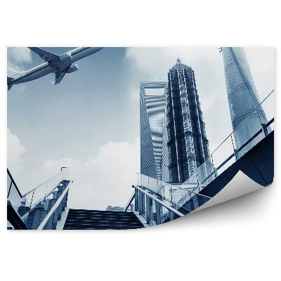 Fototapet perete Avion care zboară deasupra scărilor orașului