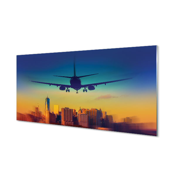 Tablou pe sticlă Avion Deasupra Orașului Cu Cer Colorat