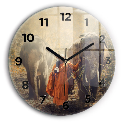 Un călugăr care conduce elefanți Ceas din sticlă rotund